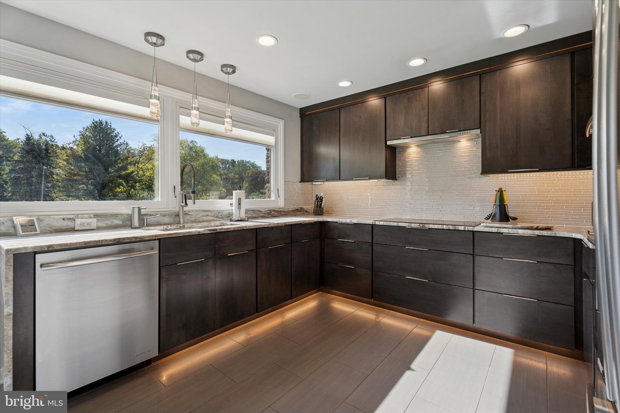 1641 Chattin Road Glenside, PA 19038 - Photo 7 of 48 a kitchen with stainless steel appliances a sink stove and cabinets