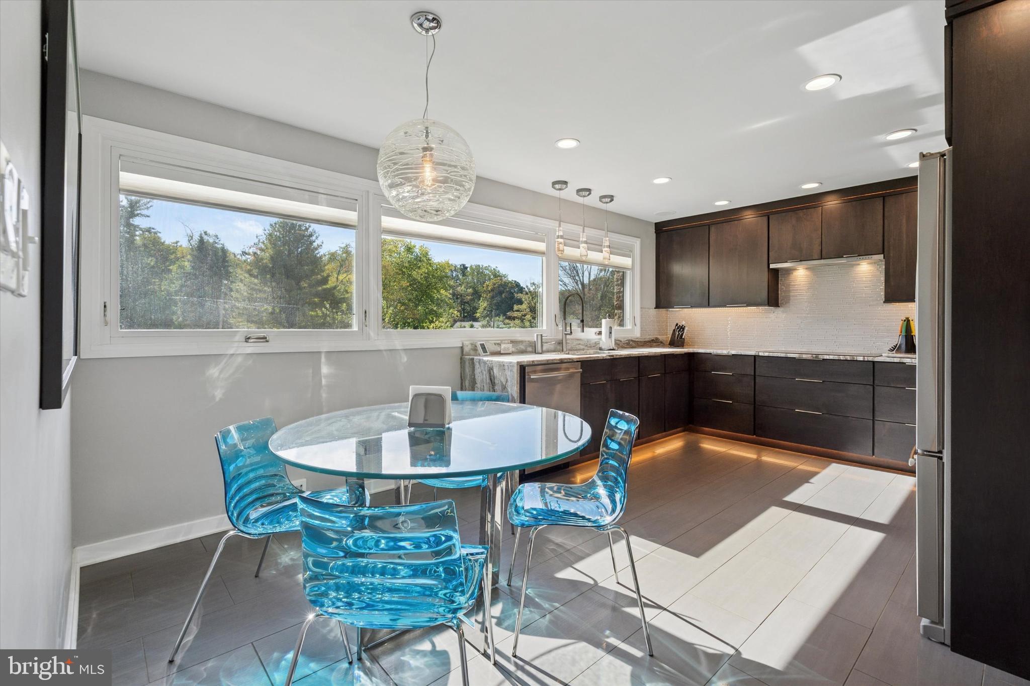 1641 Chattin Road Glenside, PA 19038 - Photo 9 of 48 a dining room with furniture a rug and a chandelier
