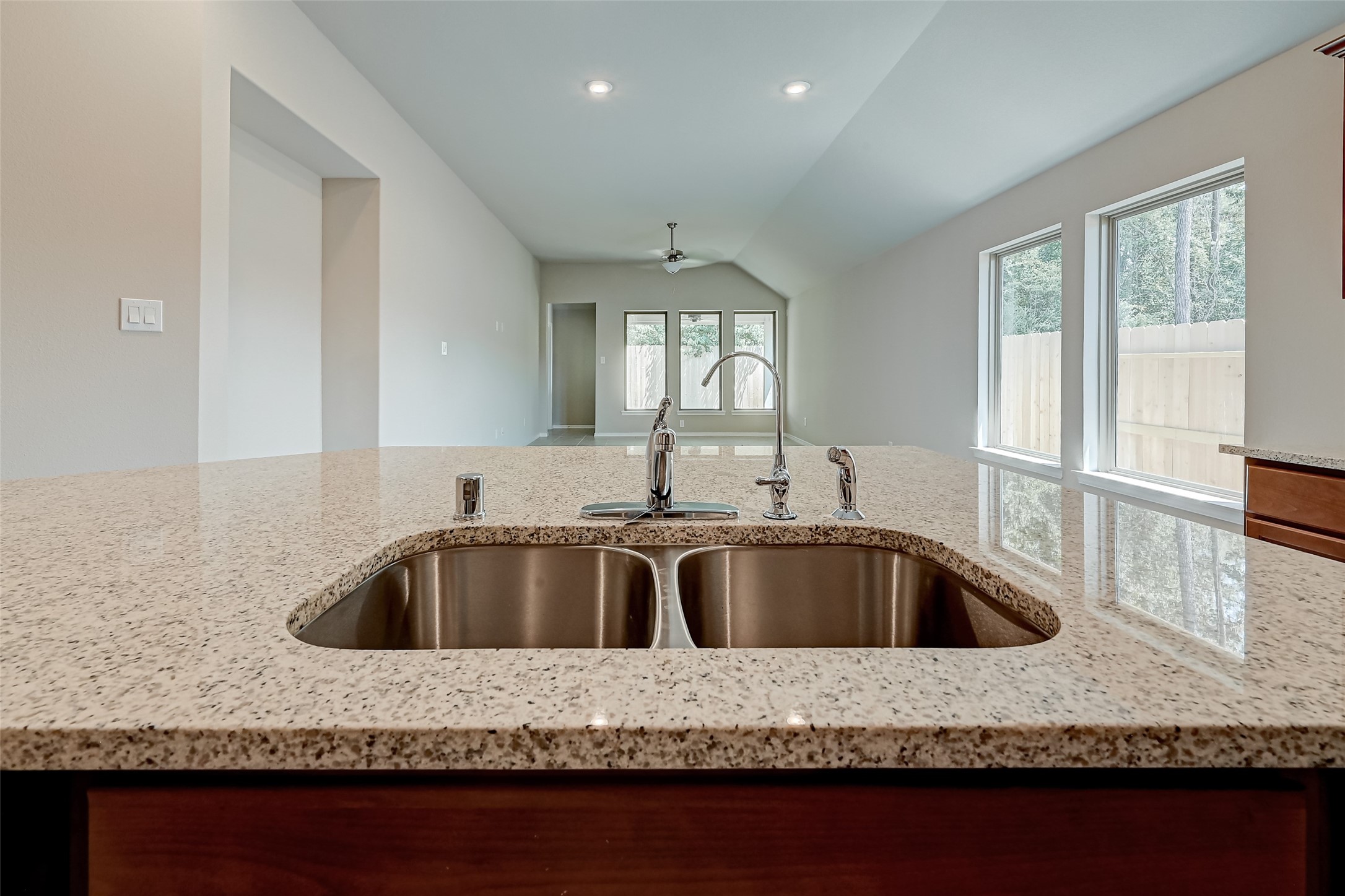 32037 Towering Birch Trail Conroe, TX 77385 - Photo 12 of 38 a view of kitchen sink microwave and outdoor space