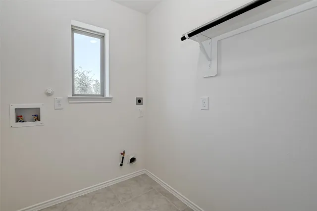 a view of an empty room and closet area