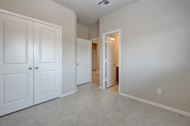 a bathroom with a sink toilet vanity and shower