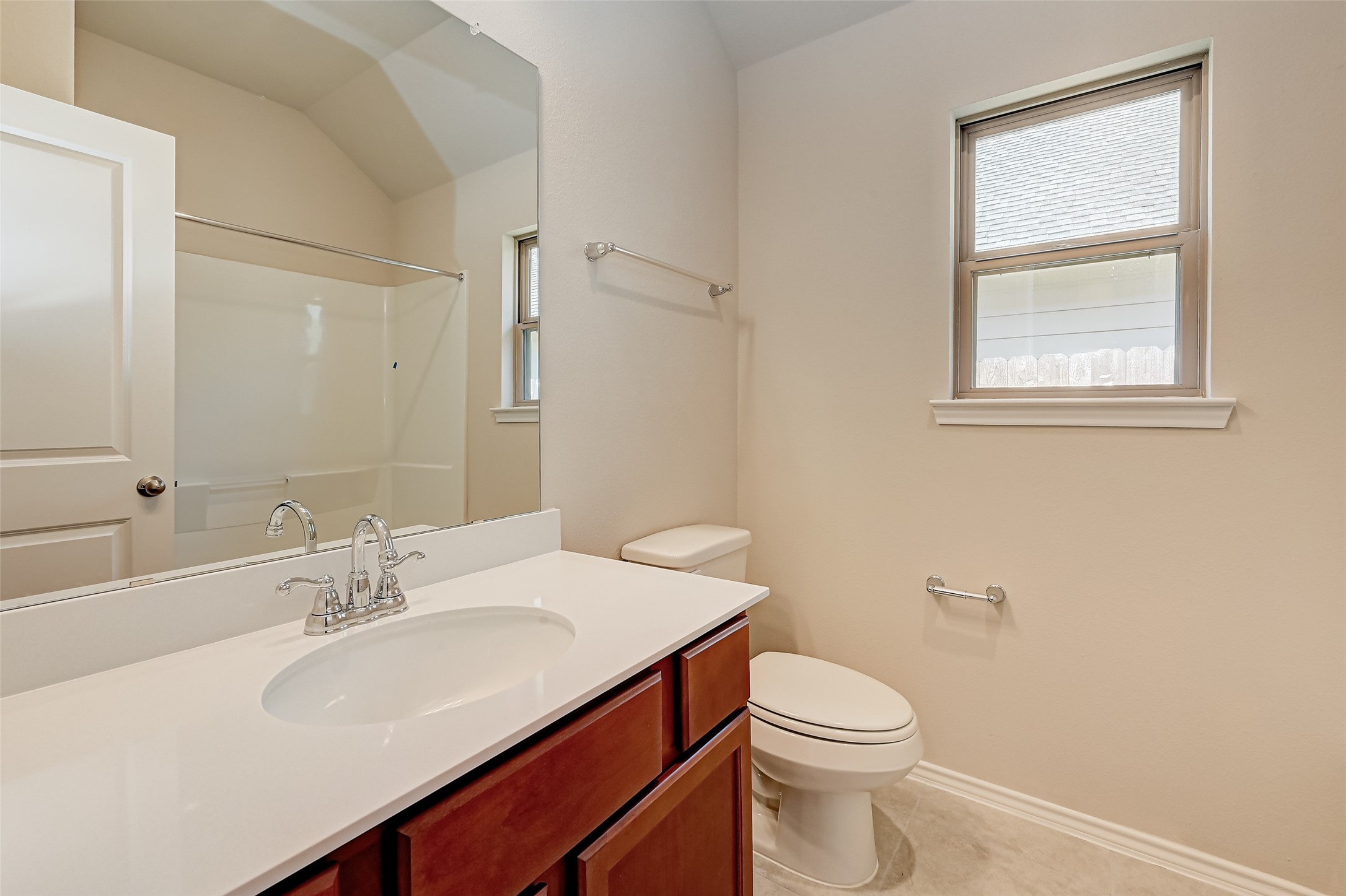 32037 Towering Birch Trail Conroe, TX 77385 - Photo 22 of 38 a bathroom with a sink vanity mirror and toilet
