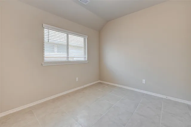 an empty room with closet area