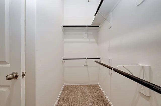 a view of a backyard with wooden fence