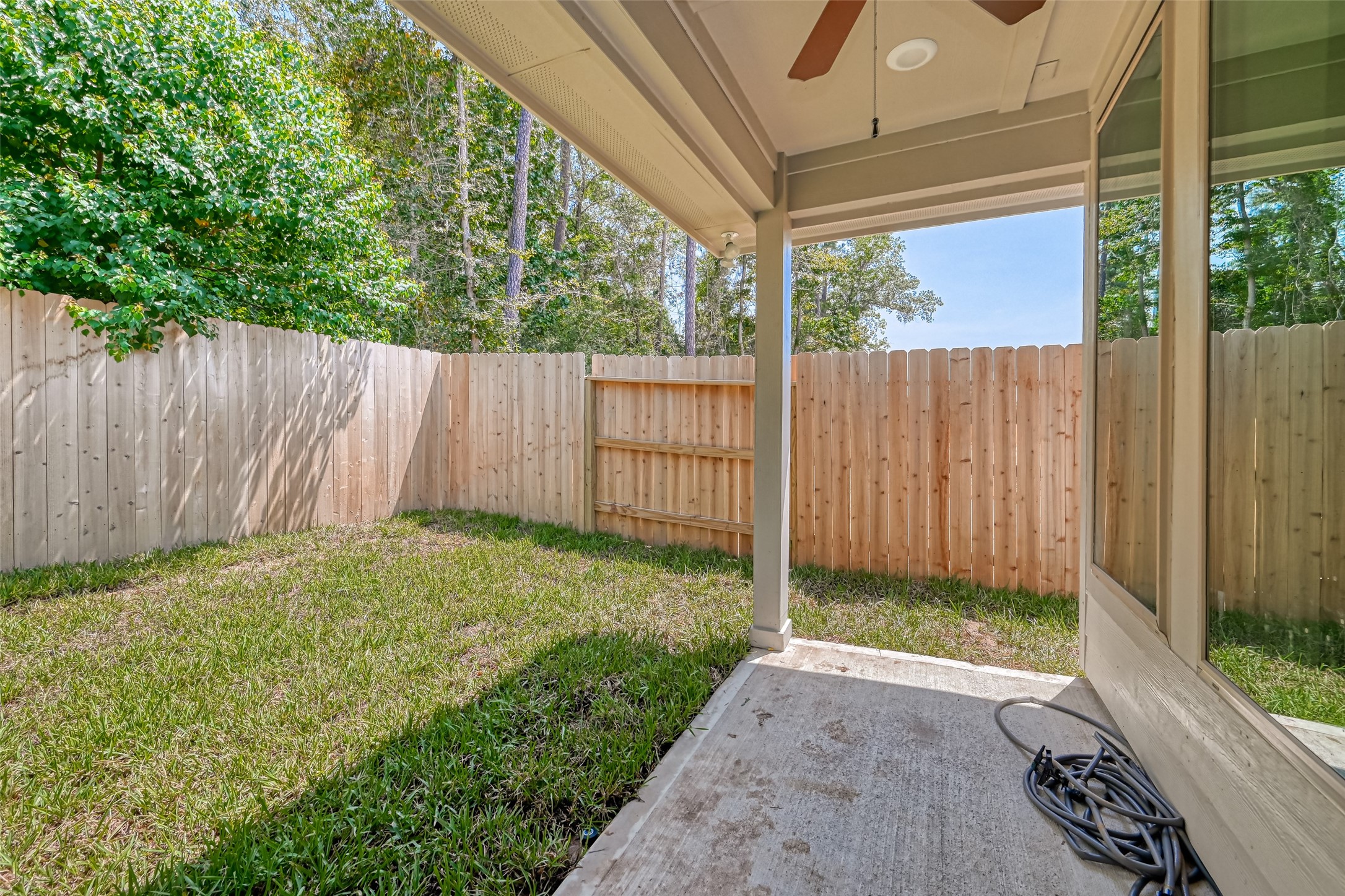 32037 Towering Birch Trail Conroe, TX 77385 - Photo 33 of 38 a view of a backyard with wooden fence