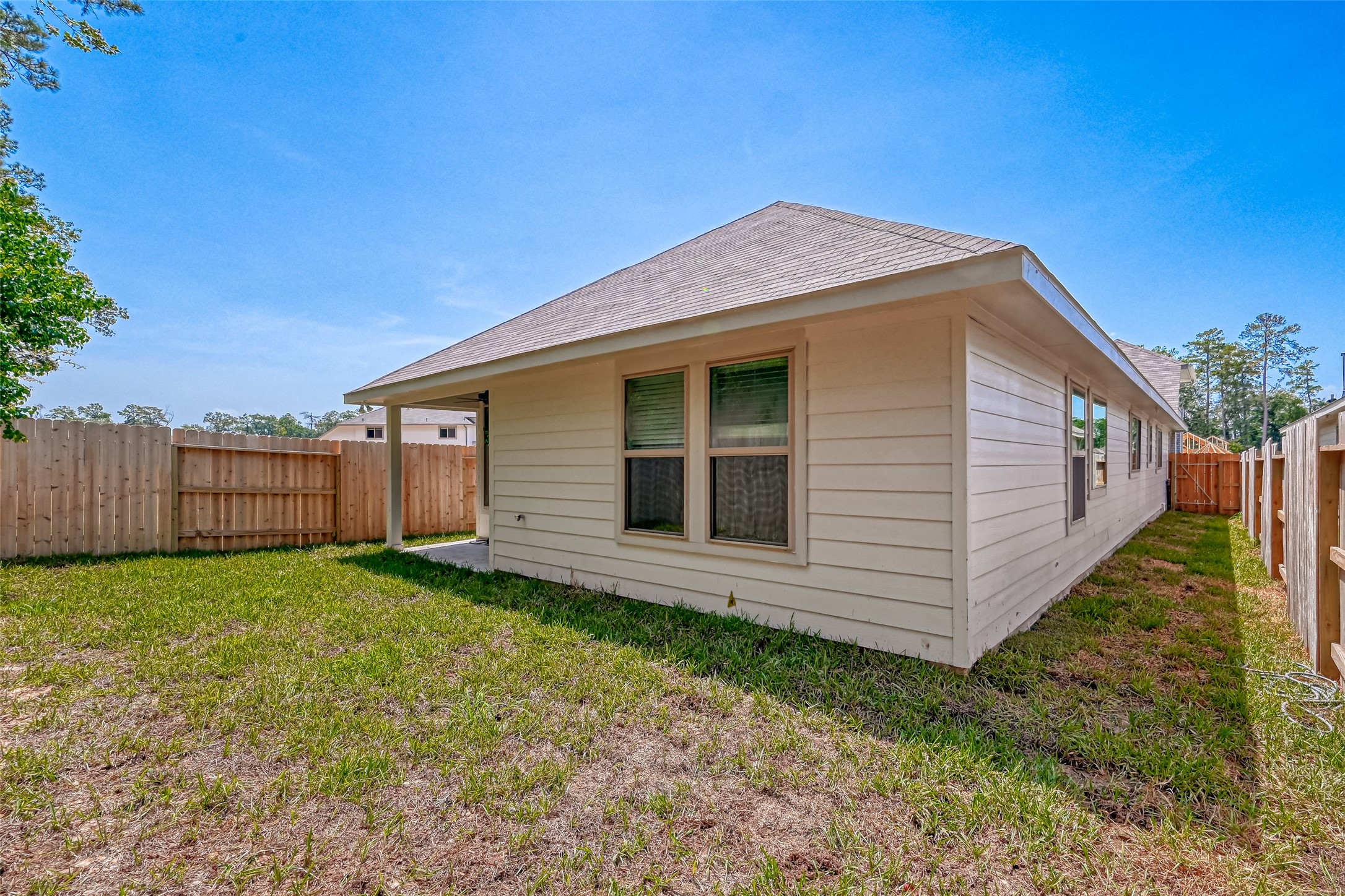 32037 Towering Birch Trail Conroe, TX 77385 - Photo 37 of 38 a view of a house with a yard