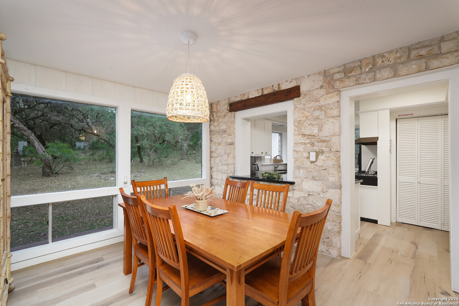550 County Road 262 Mico, TX 78056 - Photo 19 of 58 a view of a dining room with furniture window and wooden floor