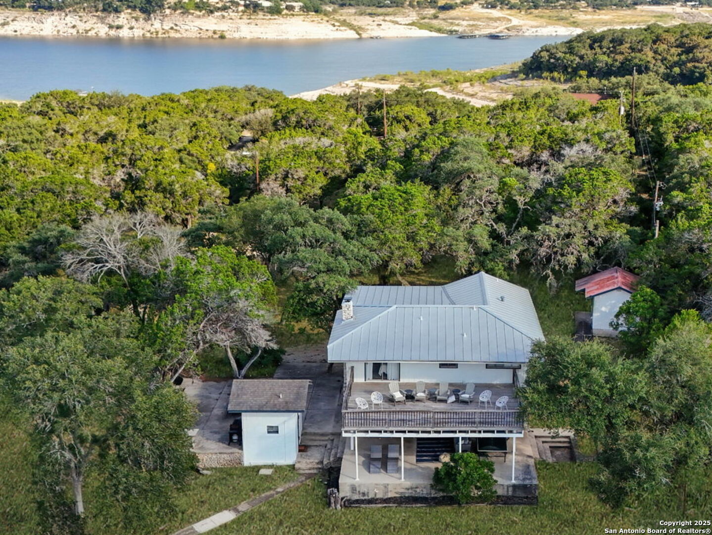 550 County Road 262 Mico, TX 78056 - Photo 2 of 58 an aerial view of a house with lake view