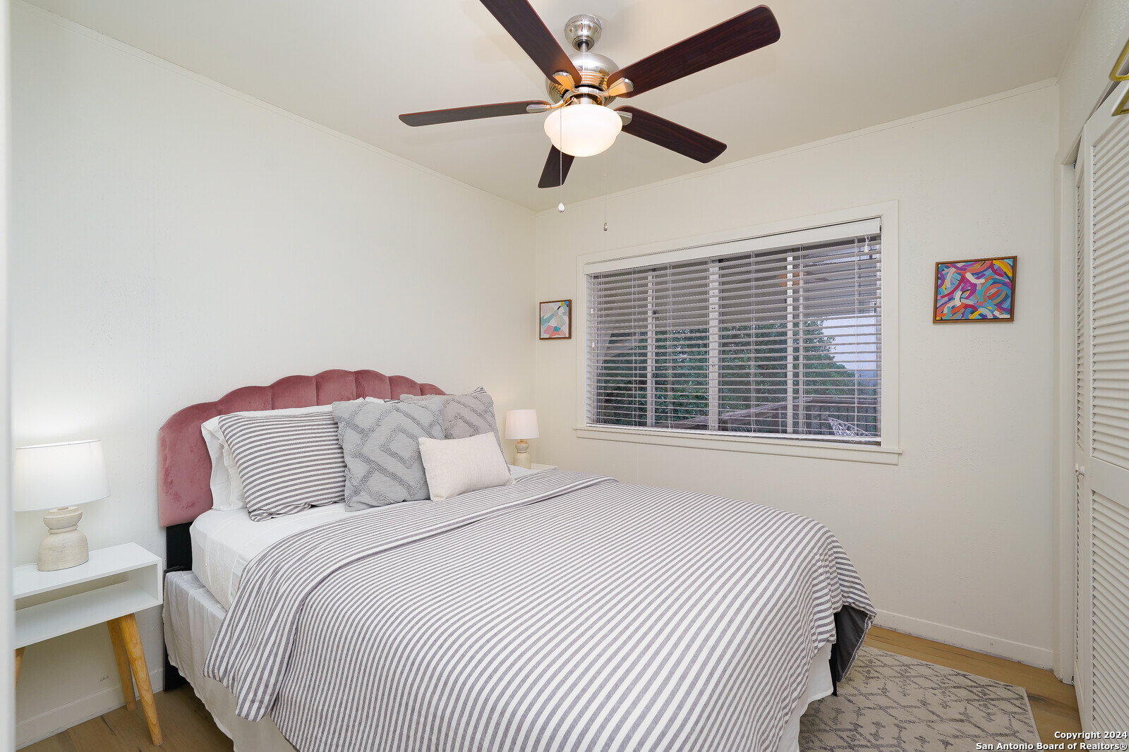 550 County Road 262 Mico, TX 78056 - Photo 30 of 58 a bedroom with a large bed and a window