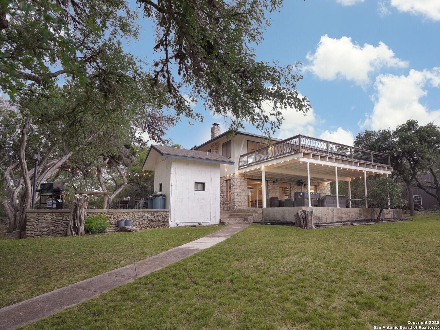 550 County Road 262 Mico, TX 78056 - Photo 35 of 58 front view of a house with a yard