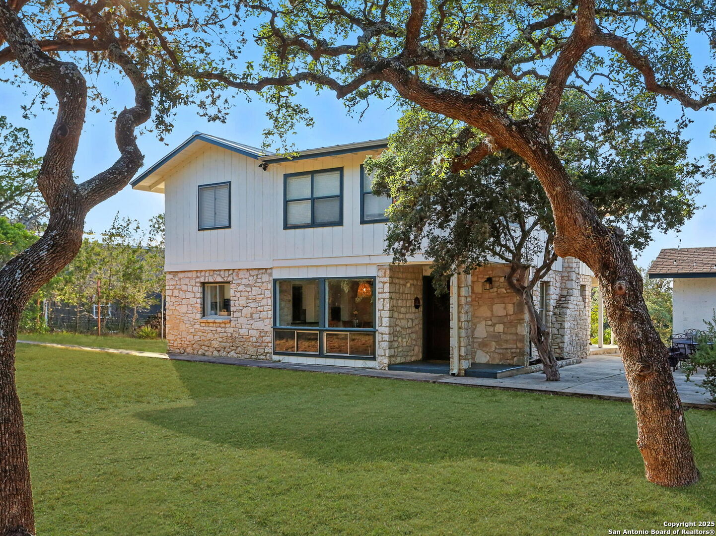 550 County Road 262 Mico, TX 78056 - Photo 4 of 58 a front view of house with yard and green space