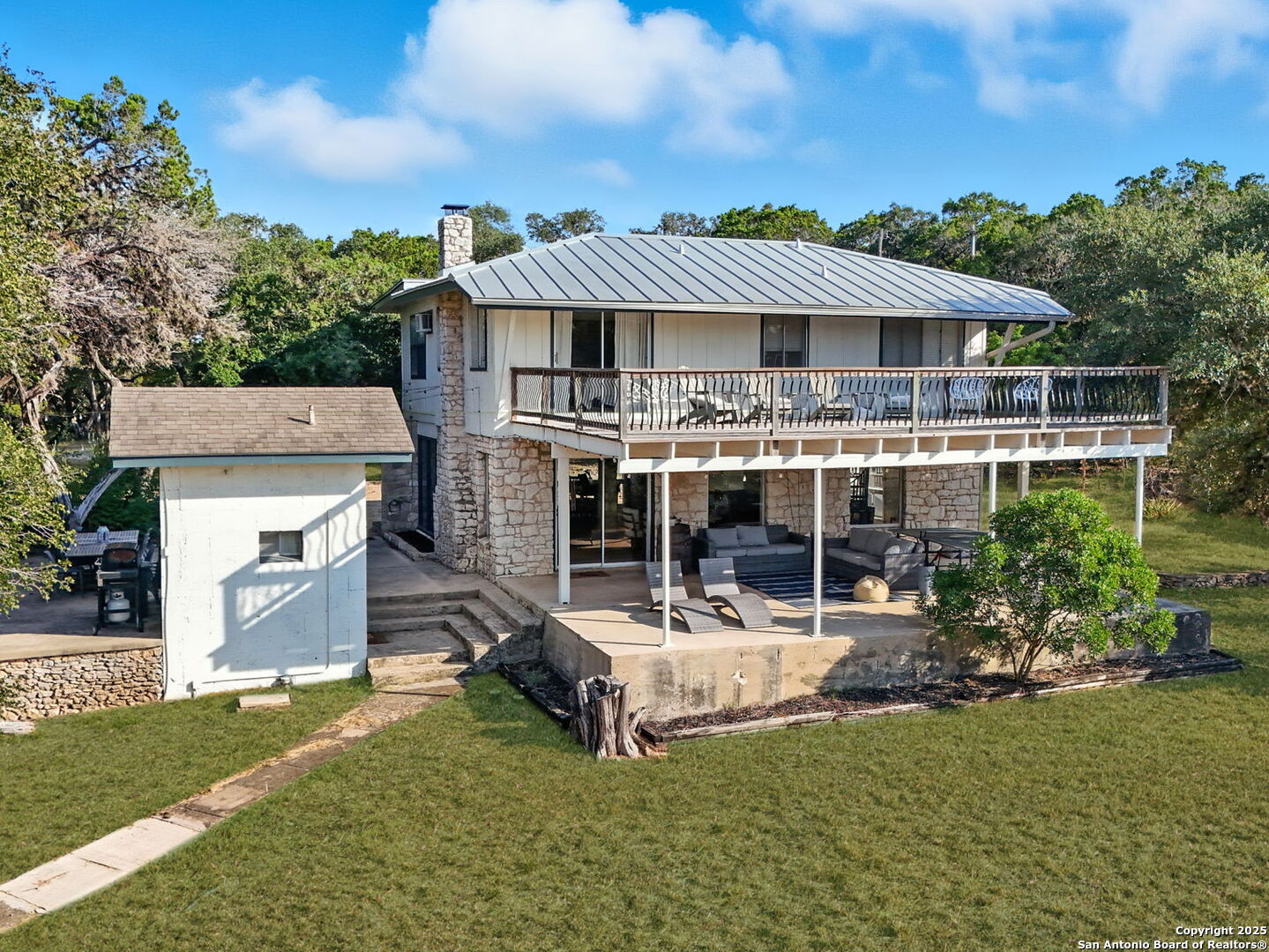 550 County Road 262 Mico, TX 78056 - Photo 50 of 58 aerial view of a house with a yard patio and fire pit