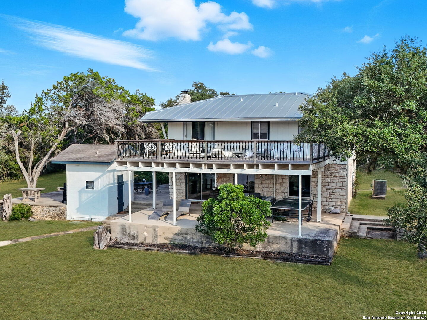 550 County Road 262 Mico, TX 78056 - Photo 51 of 58 a front view of a house with a garden