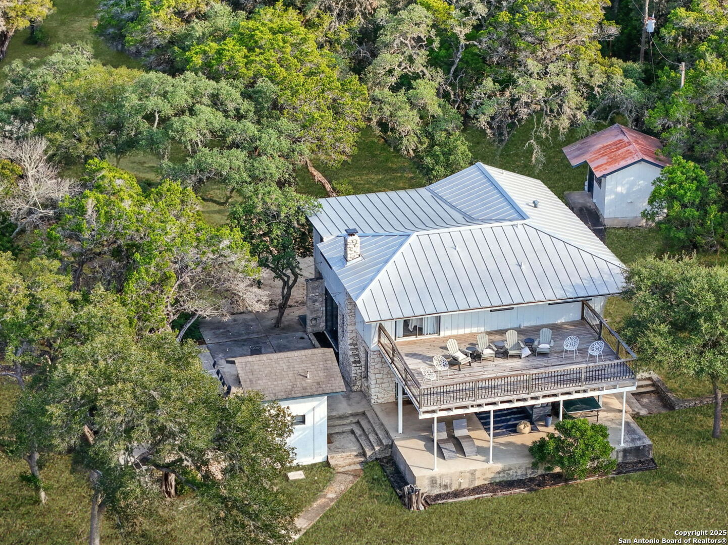 550 County Road 262 Mico, TX 78056 - Photo 54 of 58 a view of a house with a yard deck and furniture