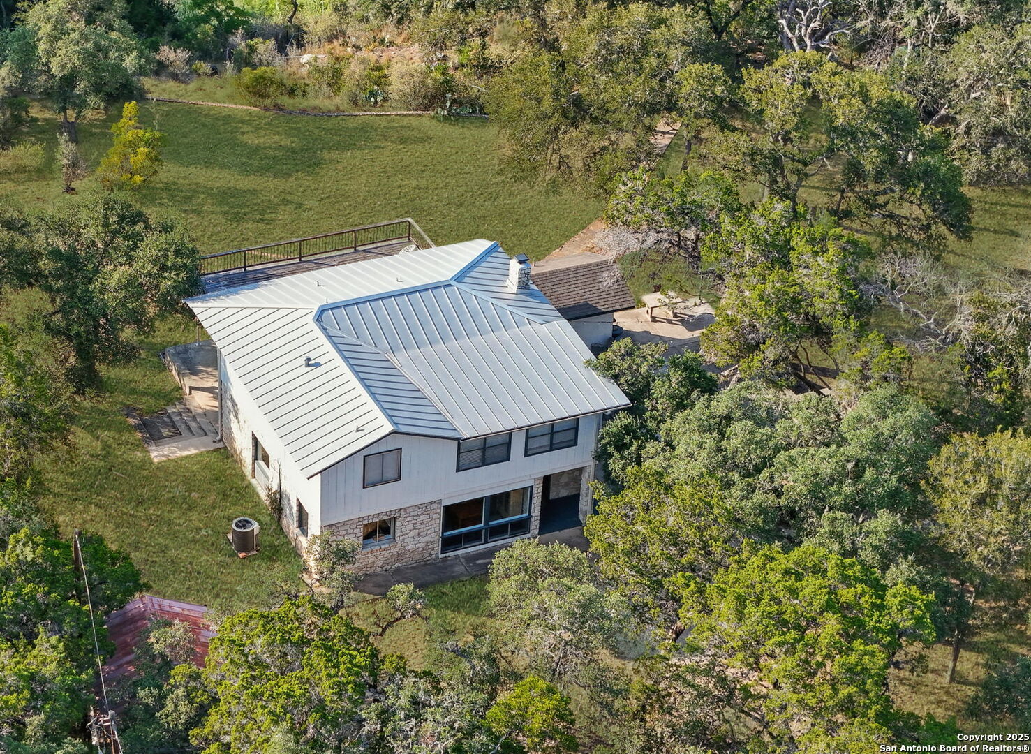550 County Road 262 Mico, TX 78056 - Photo 56 of 58 an aerial view of a house with a yard and lake view