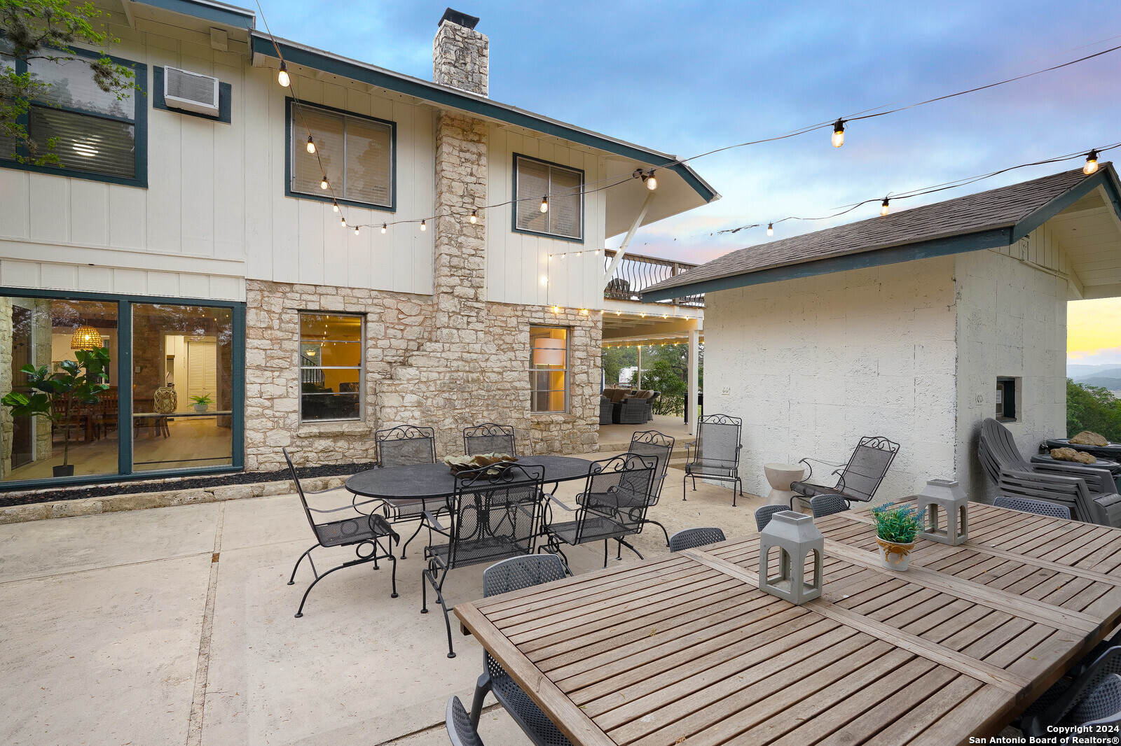 550 County Road 262 Mico, TX 78056 - Photo 7 of 58 a view of a patio with table and chairs and potted plants