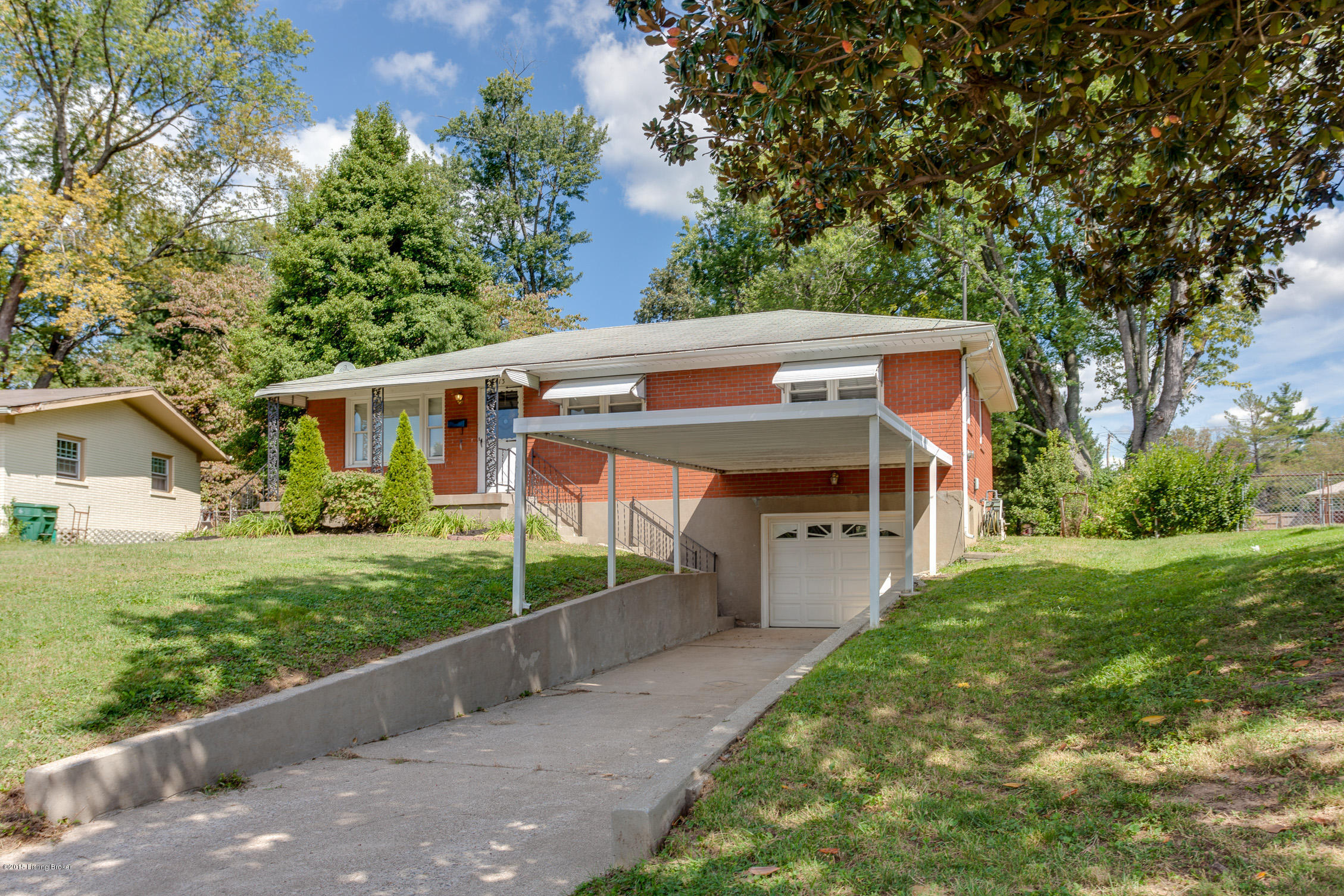 5413 Layne Road Louisville, KY 40219 - Photo 2 of 21 extra long carport as well as attached garage