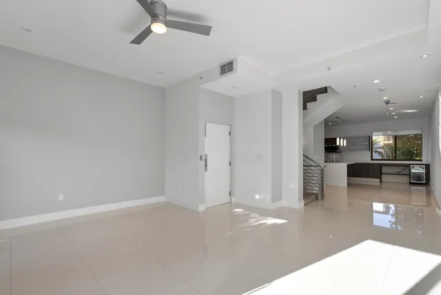 a view of an empty room with glass door