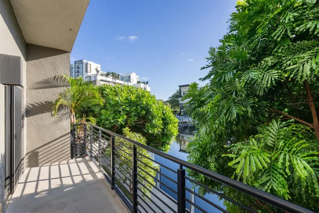 a view of a living room and kitchen with furniture