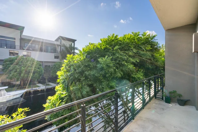 a view of balcony with wooden floor and plants