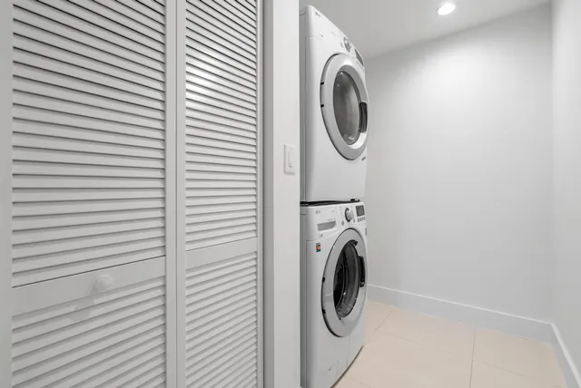 a city view from a balcony with outdoor seating