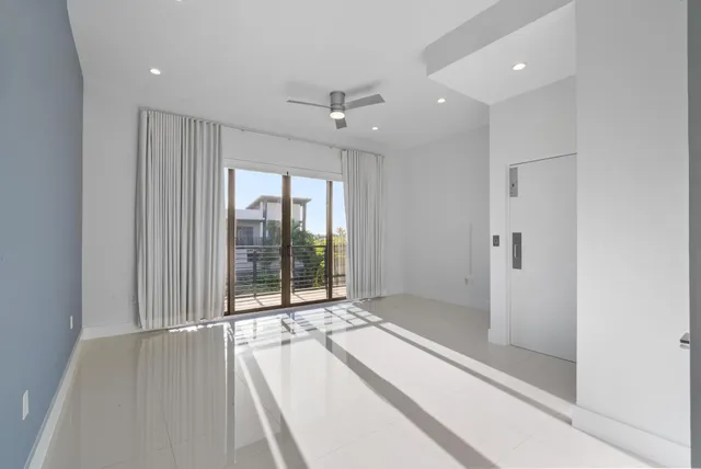 a bathroom with a double vanity sink a mirror and a bathtub