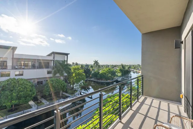 a spacious bathroom with a shower a sink and a mirror
