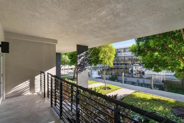 a view of a lake with chairs