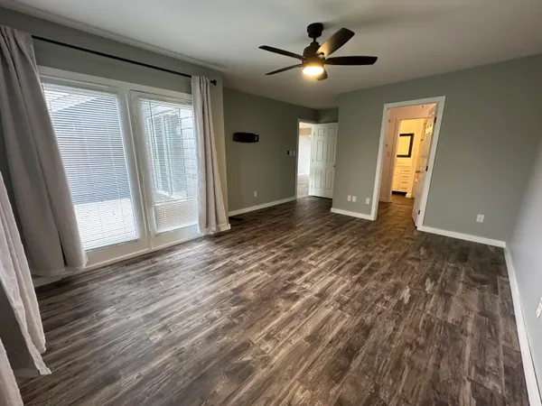 a view of walk in closet with empty racks