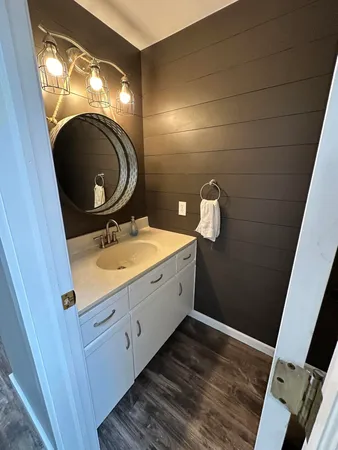 a bathroom with a sink and a mirror