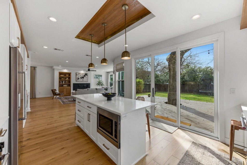 1301 Madison Avenue Austin, TX 78757 - Photo 12 of 39 a large kitchen with stainless steel appliances granite countertop a large stove a sink and a refrigerator
