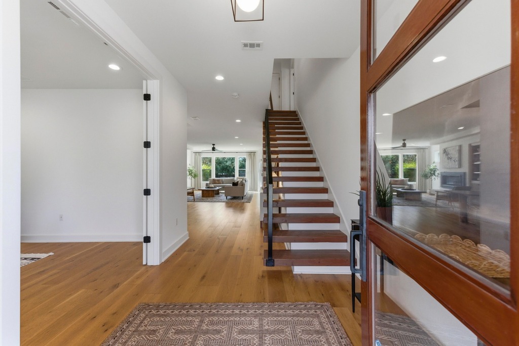 1301 Madison Avenue Austin, TX 78757 - Photo 17 of 39 a view of entryway and hall with wooden floor