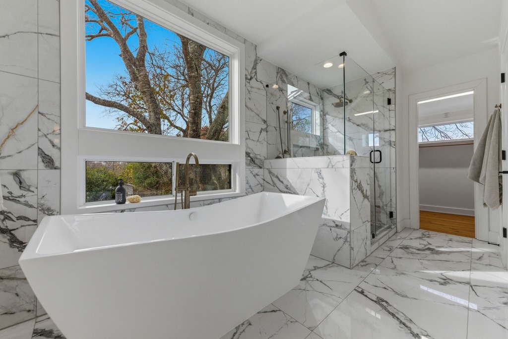 1301 Madison Avenue Austin, TX 78757 - Photo 24 of 39 a bathroom with a bathtub and a shower