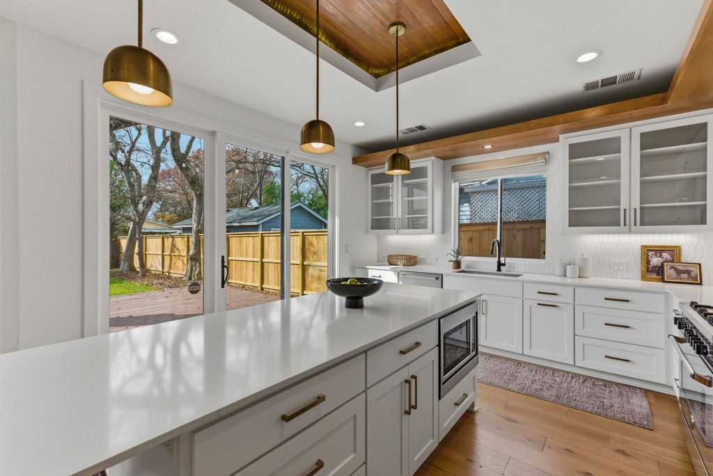 1301 Madison Avenue Austin, TX 78757 - Photo 10 of 39 a kitchen with counter top space and a sink