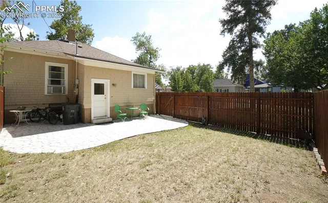 a house with trees in the background