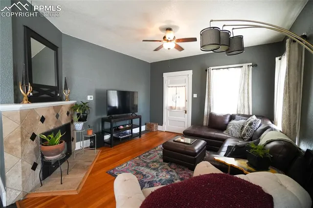 a living room with furniture and a flat screen tv