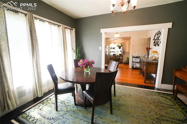 a view of a dining room with furniture window and wooden floor