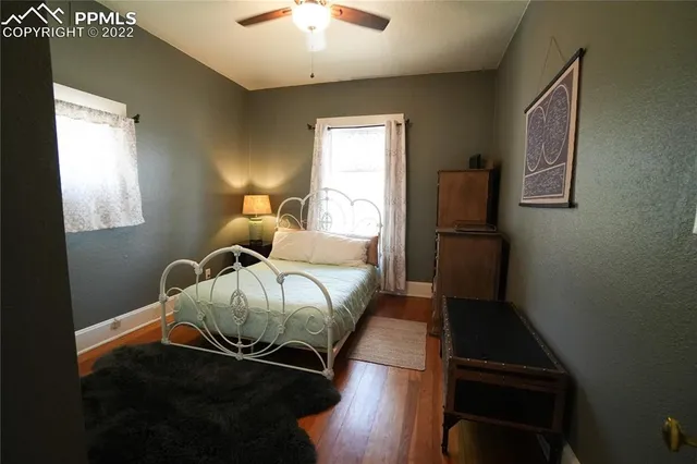 a bedroom with bed and window