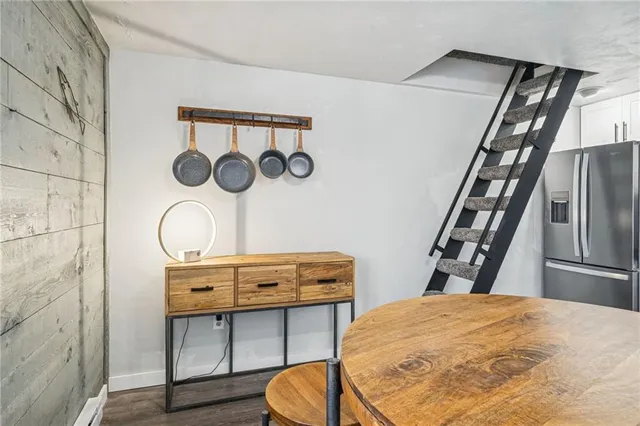 a bedroom with a bed and a table in it