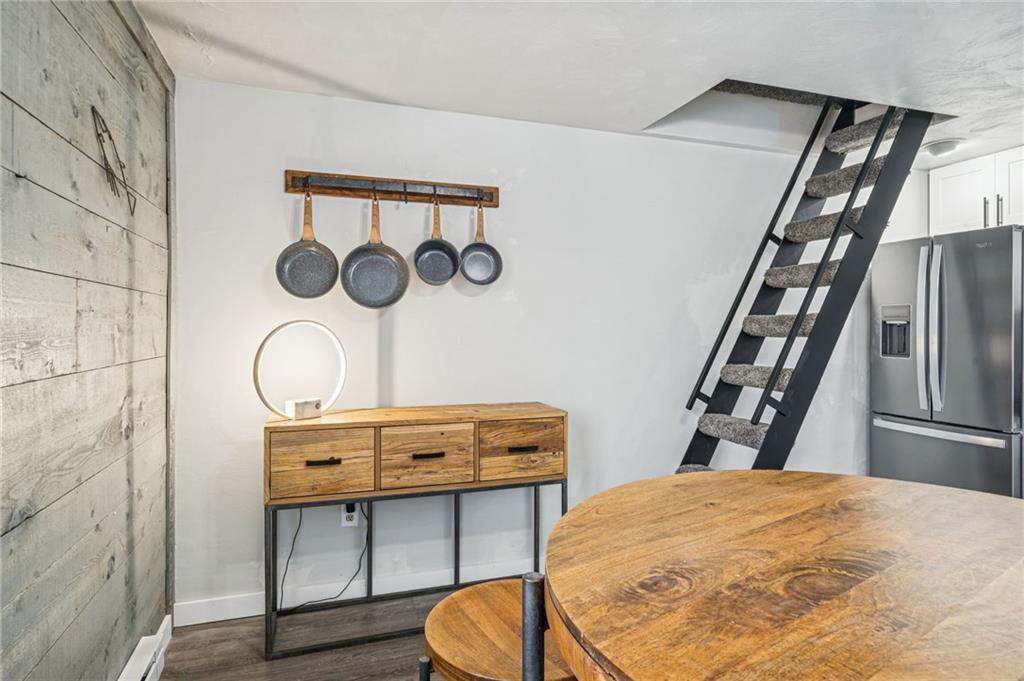 582 Maple Court Hidden Valley, PA 15502 - Photo 13 of 38 a bedroom with a bed and a table in it