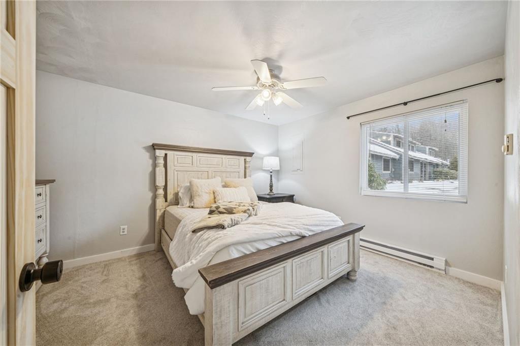 582 Maple Court Hidden Valley, PA 15502 - Photo 15 of 38 a bedroom with a bed and a window