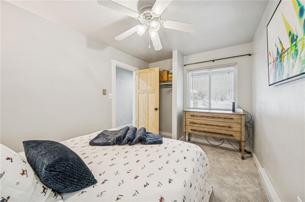 582 Maple Court Hidden Valley, PA 15502 - Photo 23 of 38 a bedroom with a bed dresser and a window