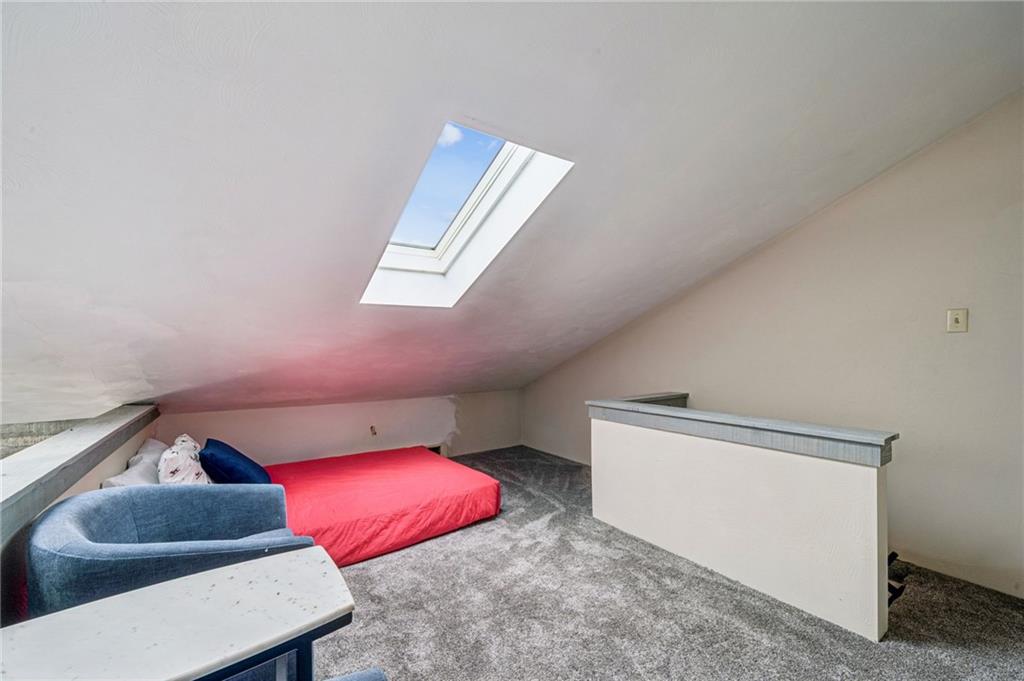 582 Maple Court Hidden Valley, PA 15502 - Photo 27 of 38 a living room with furniture and a lamp