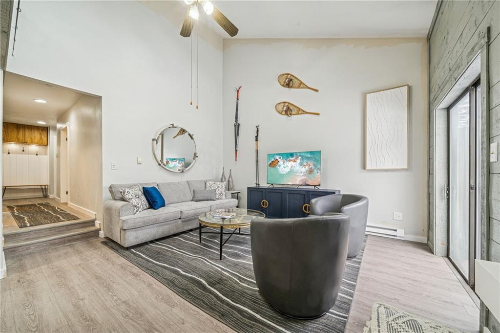 582 Maple Court Hidden Valley, PA 15502 - Photo 5 of 38 a living room with furniture and a chandelier