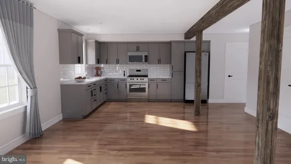 a large kitchen with a stove a refrigerator and a sink