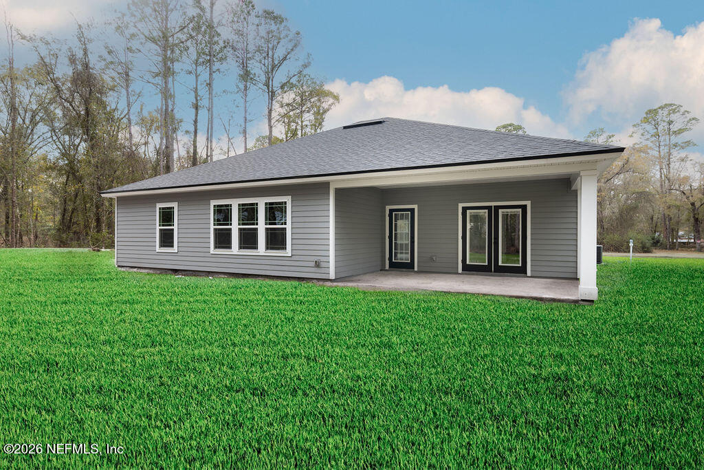 2491 Marigold Avenue Middleburg, FL 32068 - Photo 33 of 34 a view of a house with backyard porch and garden