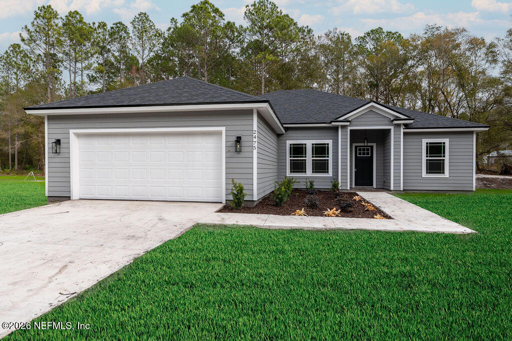 2491 Marigold Avenue Middleburg, FL 32068 - Photo 4 of 34 a front view of house with yard and green space
