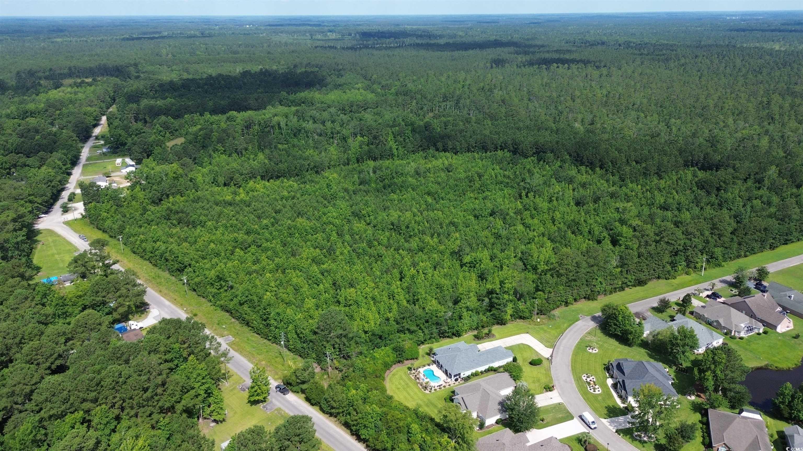 Tbd Elbow Road Longs, SC 29568 - Photo 4 of 14 Aerial view of property and surrounding area with a heavily wooded area