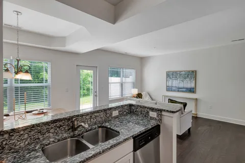 a kitchen with a sink and a window