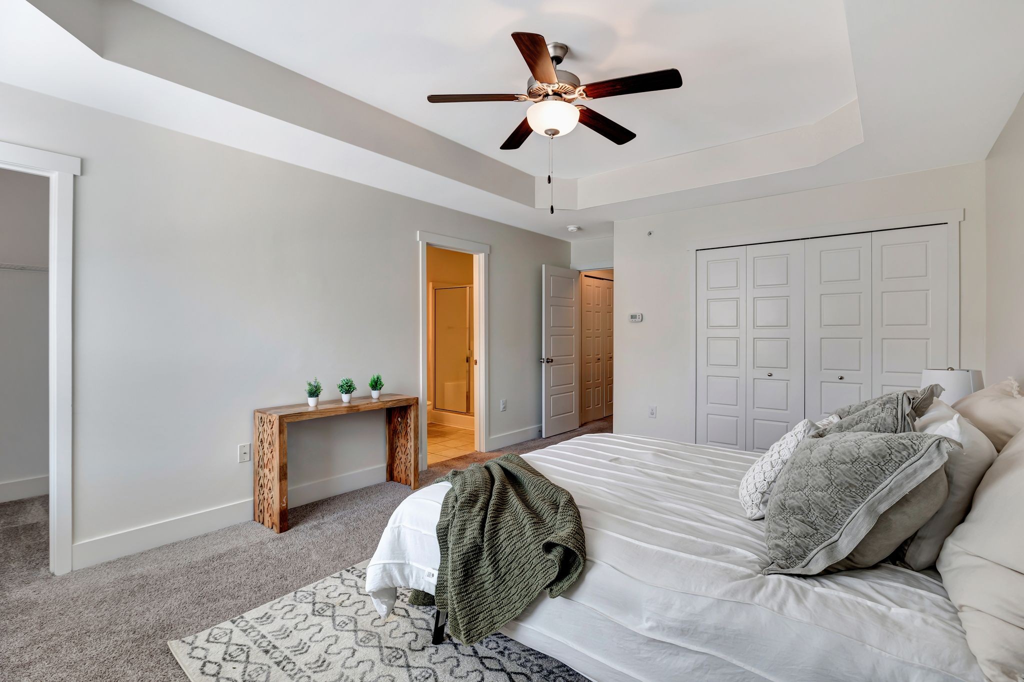 1134 Somerset Springs Drive Spring Hill, TN 37174 - Photo 17 of 28 a bedroom with a bed and a chandelier